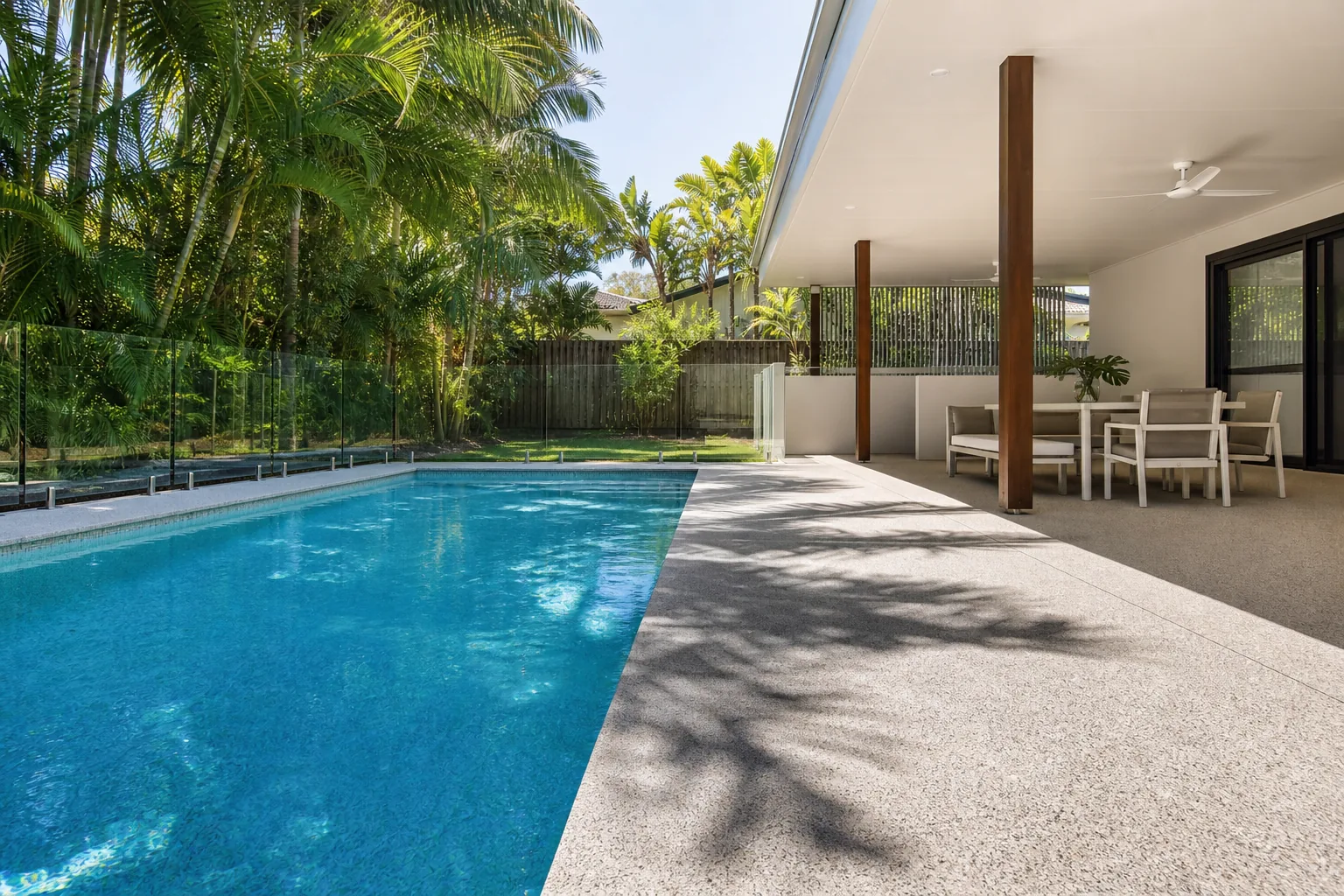 Exposed aggregate pool surround and covered concrete patio on the Gold Coast